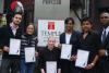 Difficulties and Rewards of Starting a Business in Japan -- The winning team with their certificates and classmate Dollar