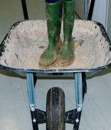 Mr. George's wheelbarrow and concrete boots